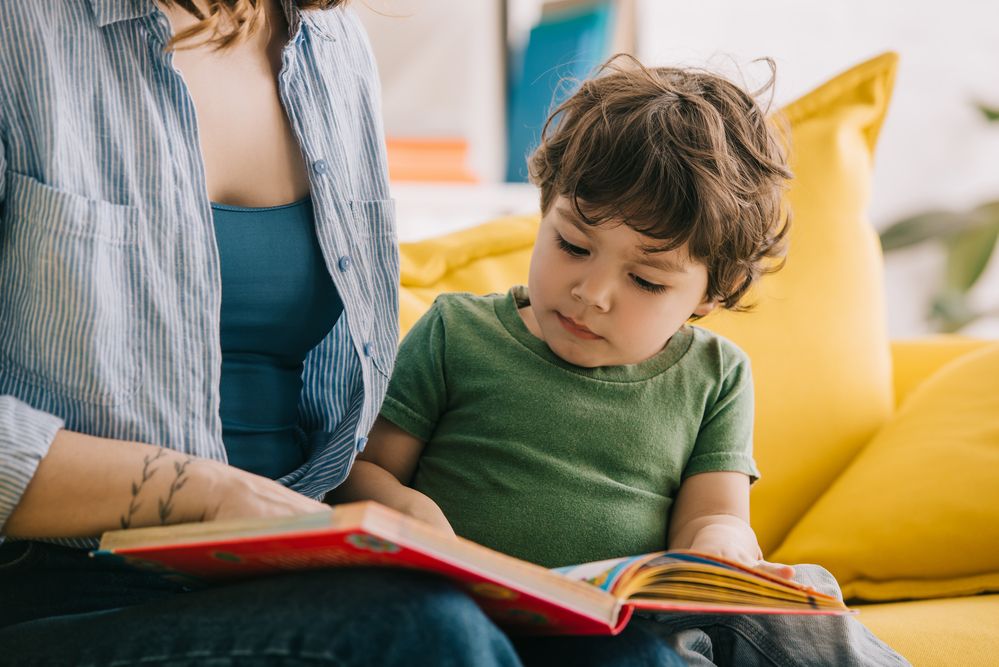 Mom helping child with simple sentences